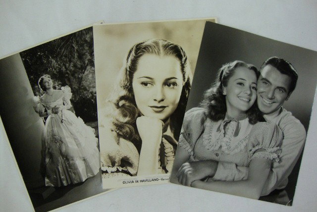 OLIVIA DE HAVILLAND MAC JULIAN & LONGWORTH: 1937 photo with George Brent in Gold Is Where You Find It. Photoplay Magazine backstamp and a stamp for the photographer, Longworth & Warner Bros.; a linen backed portrait for Warner Bros. and Vitapho