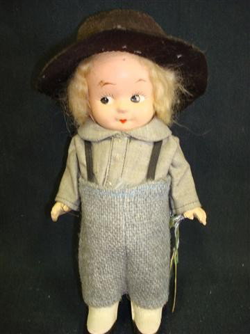 ANTIQUE COMPOSITION DOLL: Amish boy doll; painted features, shoes and socks. Original clothes and original wrist tag. Pennsylvania Dutch Dolls, Reg. U.S. Pat.; 9in. H.