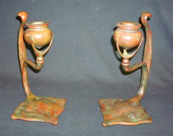 PAIR OF TIFFANY STUDIOS BRONZE CANDLESTICKS: pair of bronze cobra candlesticks with "fleur de lis" base impressed "Tiffany Studios New York and numbered 1203; 7in. H.