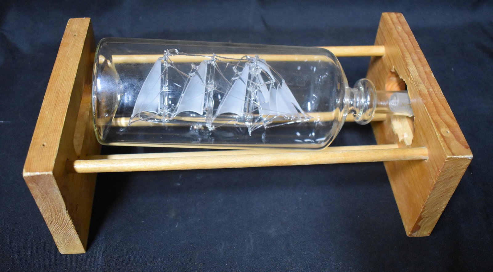 Hand Blown Glass Ship in a Bottle: With a wooden display. 10.5"