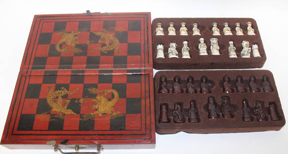 Antique Oriental Chess Set: Comes in a wooden box with dragons painted on the top, and a scene of men playing chess painted on the bottom. Opening the box reveals the game board, and underneath each half of the board are the pie