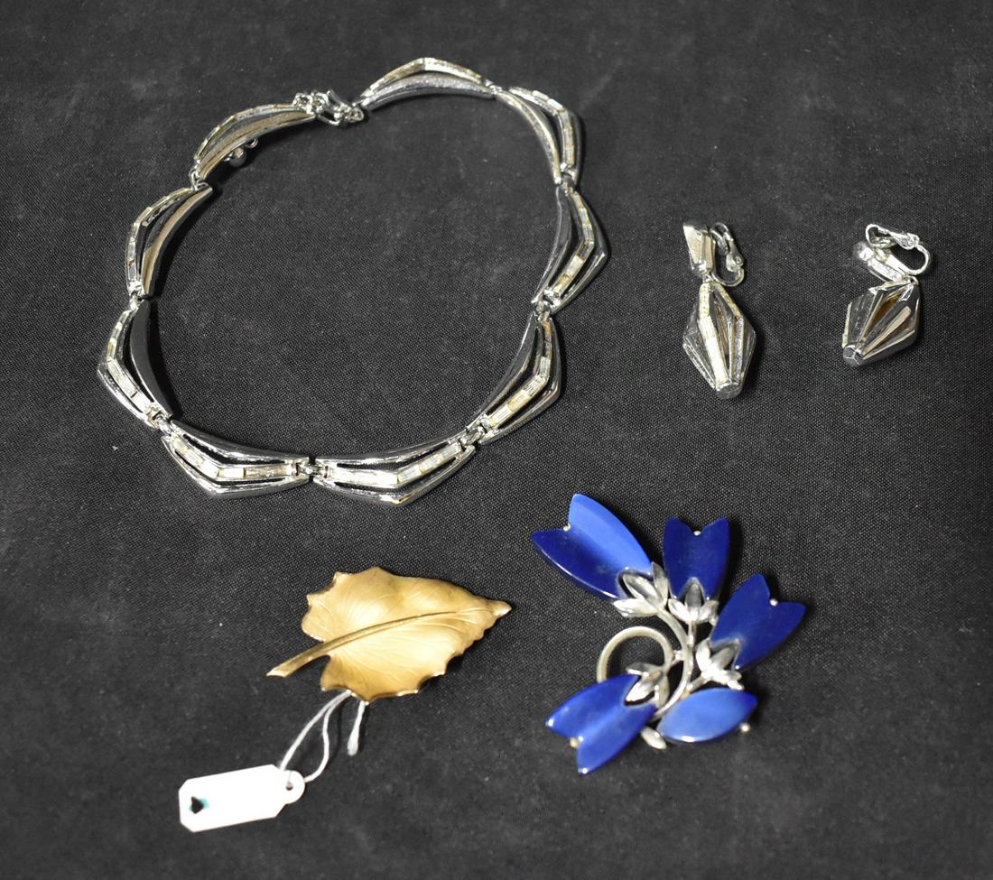 Collector's Lot Sgd. Jewelry Inc. Lisner, Trifari & Danecraft (4): Includes: Sgd Trifari Necklace & Earrings; Sgd. Danecraft Leaf Brooch mkd. 12KG.F; and a Sgd. Lisner Brooch.