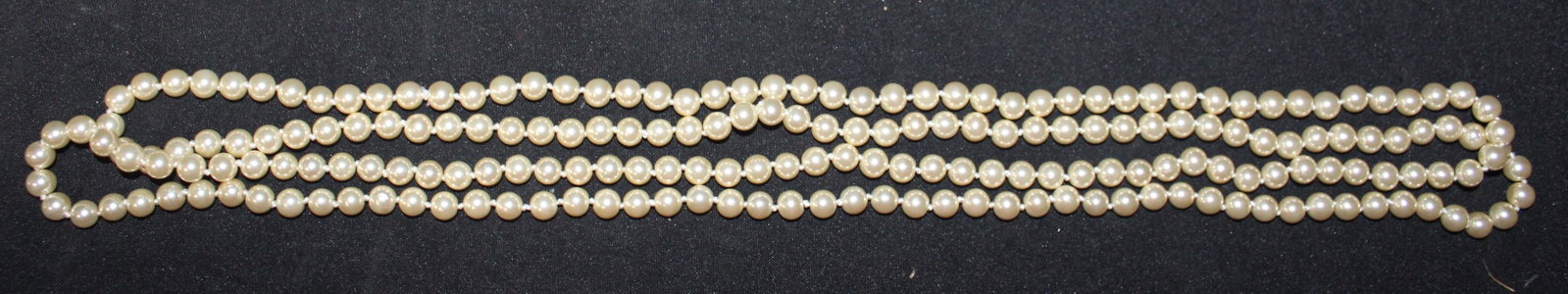Kenneth Jay Lane Pearl Necklace: 72" city simulated pearls. With COA and original warranty. Original box
