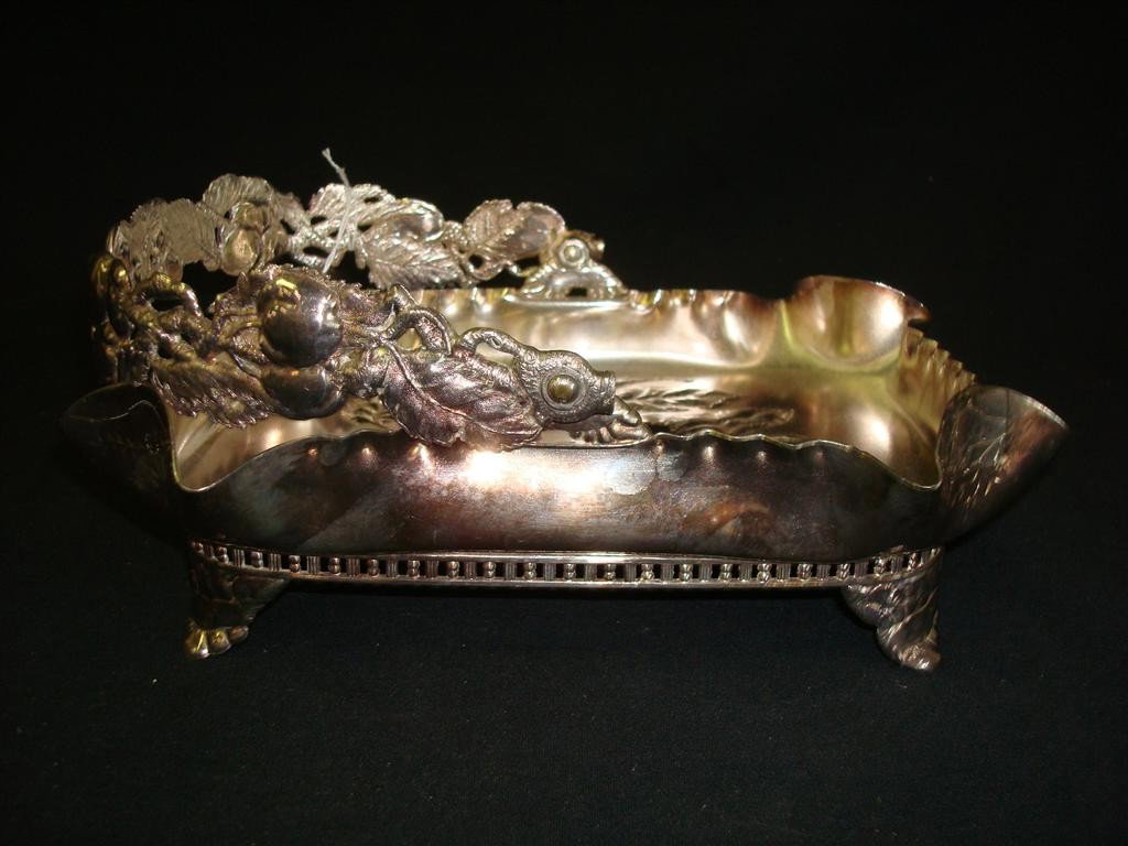PAIRPOINT APPLE CAKE BASKET: Embossed apples at base of tray, apple decorated handle, on four feet. 10-1/2 long x 8-1/4 w x 8-1/2 high