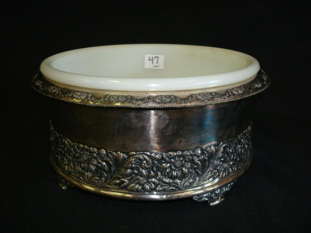 AMERICAN VICTORIAN SILVER PLATE PLANTER PAIRPOINT: With a milk glass liner with hole for drainage. Signed Pairpoint. 9" W. x 4" H.