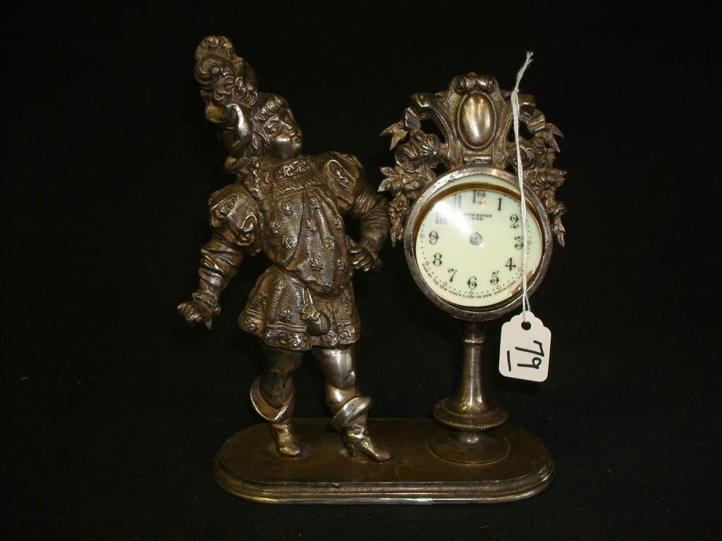 NEW HAVEN FIGURAL CLOCK: Dial is marked New Haven. Figural cavalier alongside. Replaced works. 7" H.