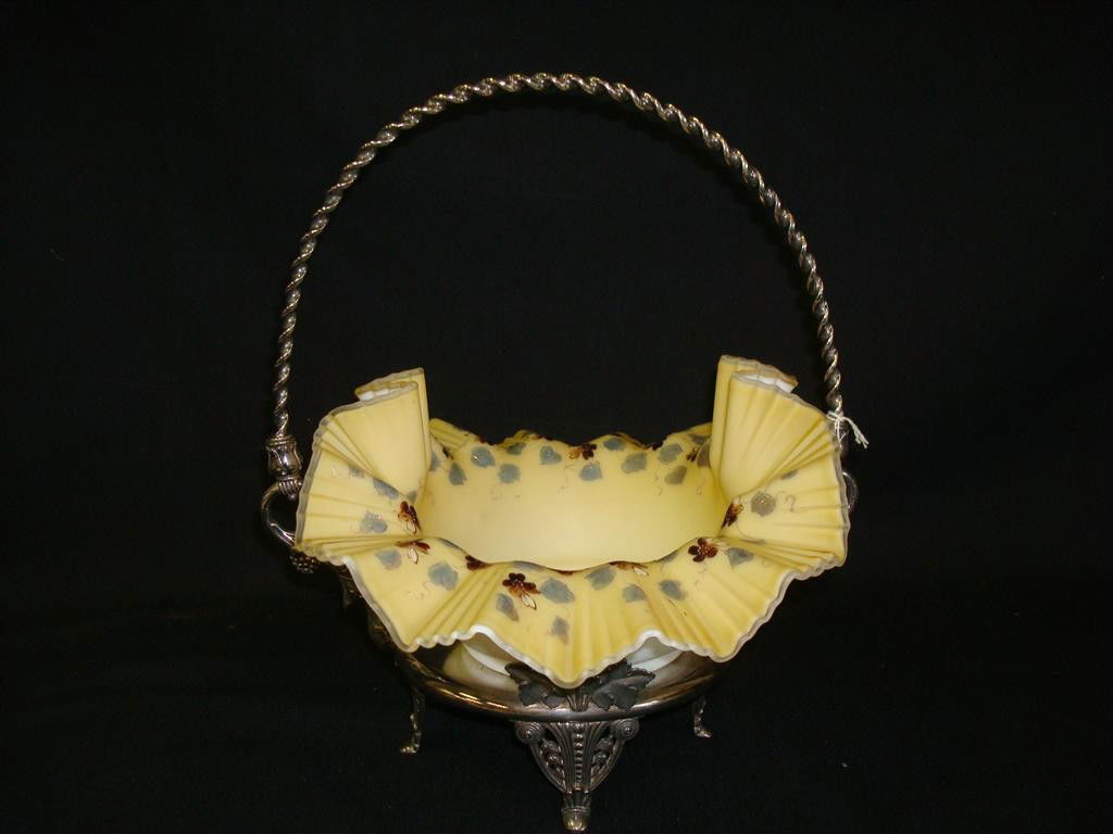 AMERICAN VICTORIAN BRIDES BASKET BY TUFTS: Mark for James W. Tufts Boston. Cased glass Mt. Washington hand painted bowl floral and leaf decorated. Raised on fancy floral and leaf supports with berry decorations. 12" H.