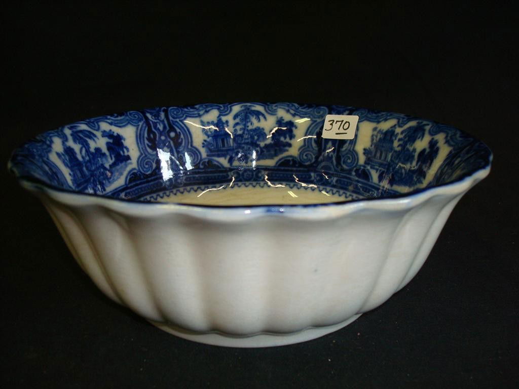 EARLY FLO BLUE BOWL: Scalloped bowl with Oriental scene. 3" h x 8-1/2" d. marked at bottom