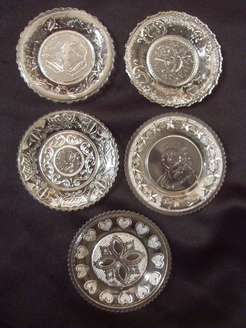 FIVE MINIATURE SANDWICH GLASS PLATES: Five clear Sandwich glass plates. The Wedding Day & Three Weeks After; hearts & lyres; Th. Jefferson; Henry Clay; and a circle of hearts. 3-1/2" wide.