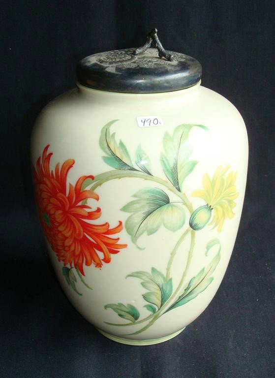 BAVARIAN PORCELAIN JAR: Hand painted floral decorations. Silver plate lid. Marked Bavaria. 10" H.