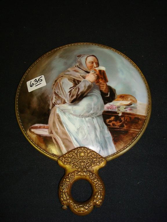 PORCELAIN DRESSING TABLE MIRROR BACK: Hand painted monk with beer stein decoration. Well detailed. Brass frame. Needs mirror insertion.