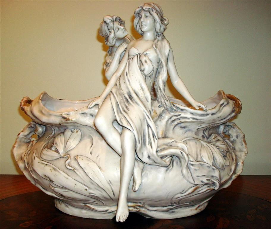 ROYAL DUX PORCELAIN GROUPING: Art Nouveau glazed porcelain figural centerpiece; with mark at bottom; 12.5in. H., 15in. W.