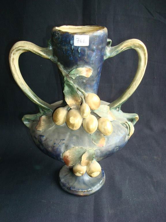 AMPHORA VASE WITH GRAPE DESIGN: Amphora double handled vase with grape decoration. Signed Amphora at the bottom. 13" H.