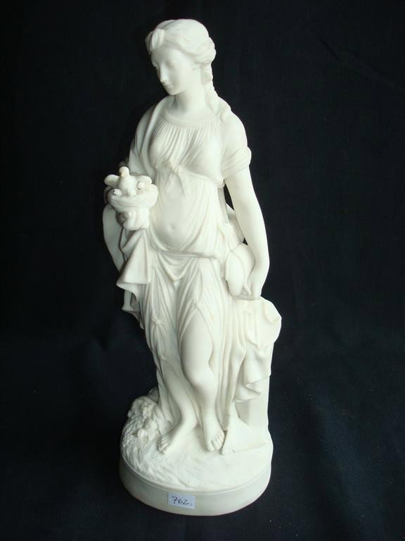 PARIAN FIGURE OF A LADY WITH A BIRD: 15" H.