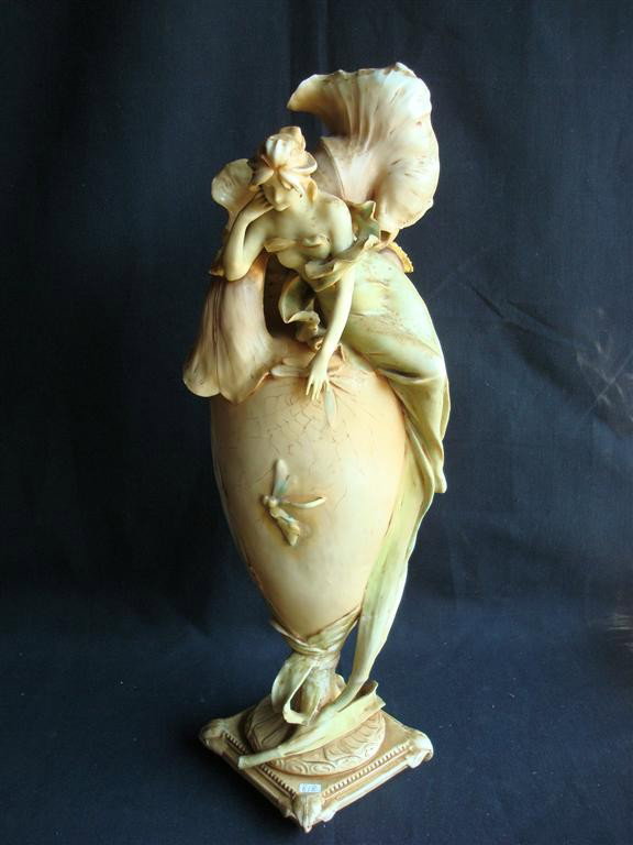 ROYAL DUX ART NOUVEAU FIGURAL VASE: Art Nouveau woman atop the frond and floral mounted vase. Without markings. (In As Is condition.) 22" H.