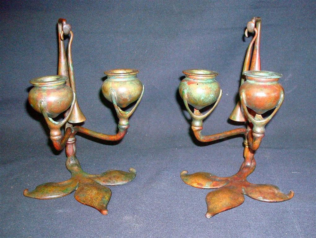 PAIR TIFFANY STUDIOS BRONZE CANDLESTICKS: Double fleur de lis bronze candlesticks with snuffers, signed Tiffany Studios NY and #'d 1232. 8-1/2" high