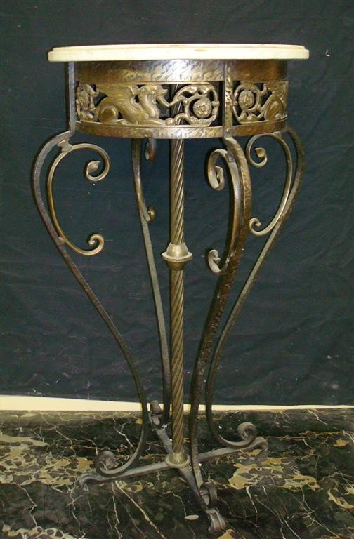 OSCAR BACH MARBLE TOP TABLE: hand hammered wrought iron pedestal table with marble top; 32.5in. H.