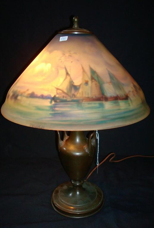 REVERSE PAINTED PAIRPOINT VENICE LAMP: Signed on the shade and on the base. Artist signed H. Fisher. Elaborate boats in harbor scene with domed building at back. Clouded sky. Probably the harbor of Venice 22"H. 15" D. to the shade.