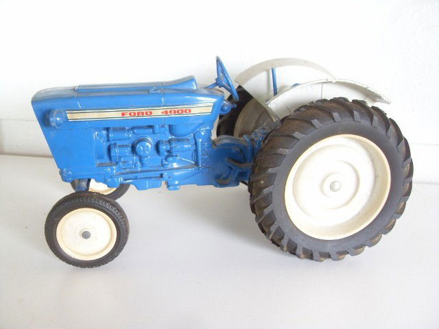 FORD 4000 TRACTOR: Blue & white Ford 4000 tractor. Manufactured by Ertl. 10-1/2" long