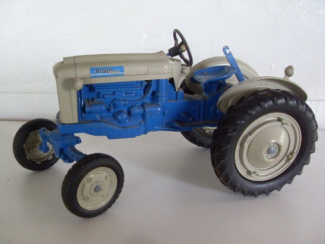FORD 4000 TRACTOR: Blue & grey Ford 4000 tractor. Manufactured by Hubley. Made by Hubley. 10" long