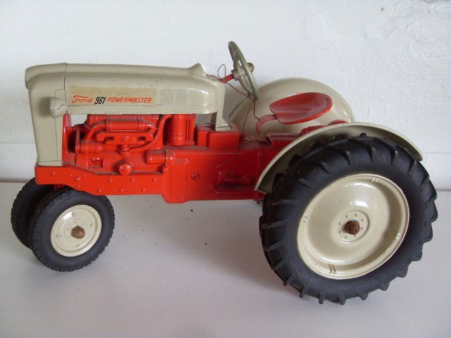 FORD 961 POWERMASTER TRACTOR: Red & tan Ford 961 Powermaster tractor. Manufactured by Hubley Kiddie Toy, Lancaster, PA. Made in USA 12-1/4" long