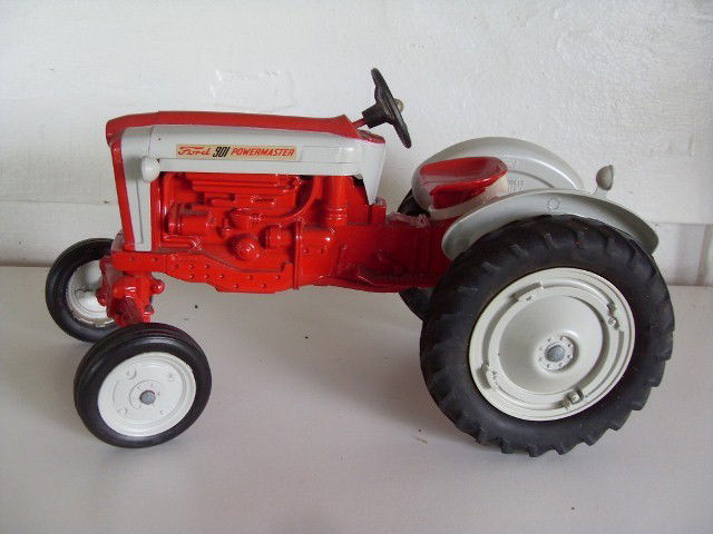 TWO FORD 901 POWERMASTER TRACTORS: Two red & grey Ford 901 Powermaster tractors. Marked Nov. 8, 1986, 9th Toy Show Tractor on one of the fenders. (Only one is shown in the photo) 10-1/4" long