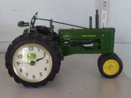 JOHN DEERE "B" TRACTOR WITH CLOCK: John Deere "B" tractor with clock inserted in wheel. Danbury Mint. Stationary, wheels do not turn. 8-3/4" long