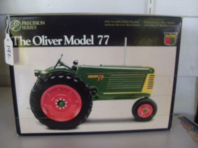 THE OLIVER MODEL 77 ROW CROP TRACTOR: The Oliver Model 77 row crop tractor. 1/16 scale. In original packaging. Precision Series. Box is 10" long