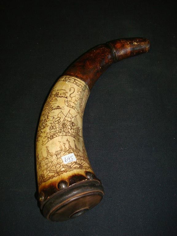 SCRIMSHAWED POWDER HORN: Nicely carved powder horn with scrimshawed decoration depicting New York; 12in. W.