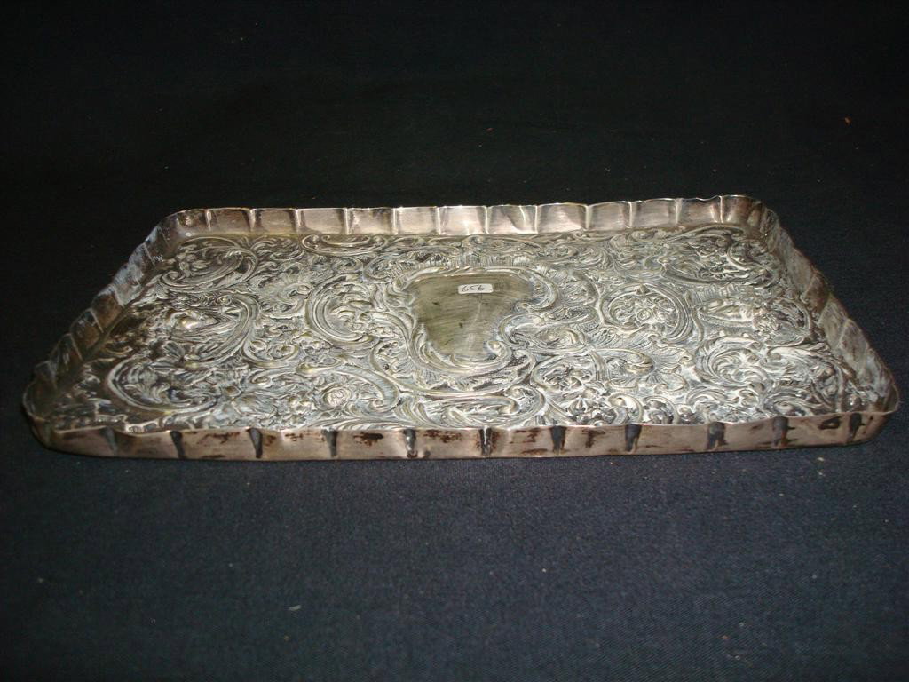 STERLING SILVER DRESSER TRAY: Highly repoussed art nouveau dressing table tray. 10 1/2" L. x 7"W.