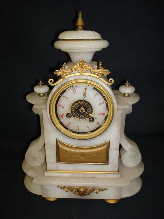 FRENCH MARBLE MANTLE CLOCK: With dome surrmount, scrolls along both sides, raised on marble shelf with dore bronze decorations; 14in. H. x 9in. W.