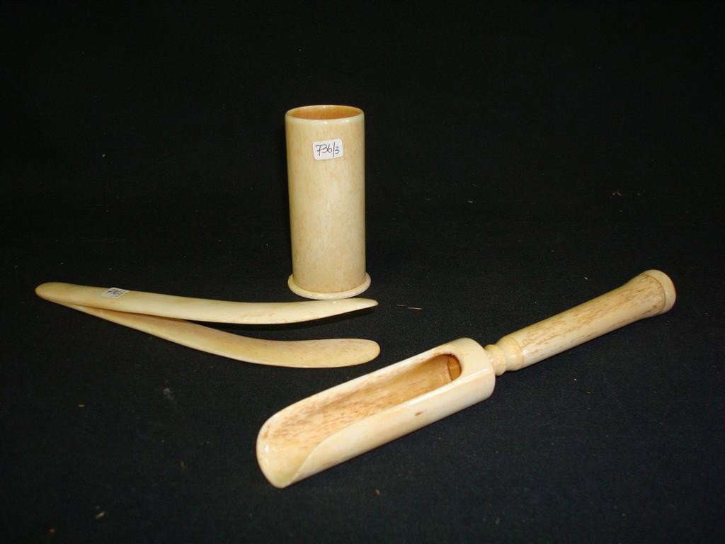 LOT OF CARVED IVORY IMPLEMENTS: A tong and a scoop in a case, perhaps sailmaker's tools; 7in. L., 3.25in. H.(box)