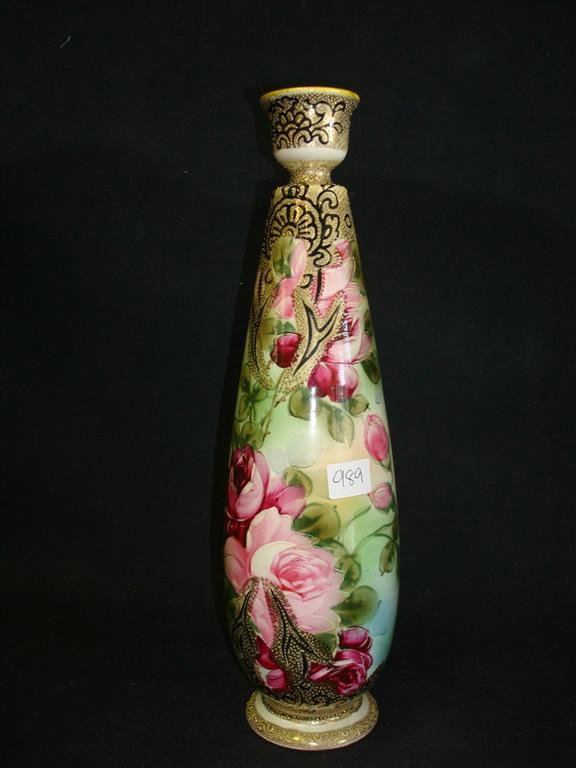 HAND PAINTED PORCELAIN VASE: Porcelain vase with rose decoration. Base marked "hand painted" with crown mark. Possibly Nippon; 12.5in. H.