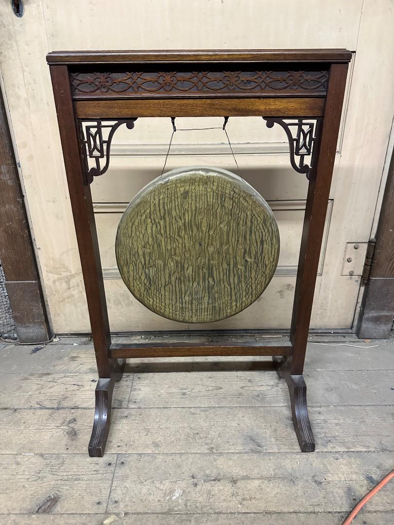 Chinese Chippendale Style Mahogany Gong Stand: Well carved mahogany gong stand. Metal gong and mallet; 33in.H. x 21in.W. x 13in.D.