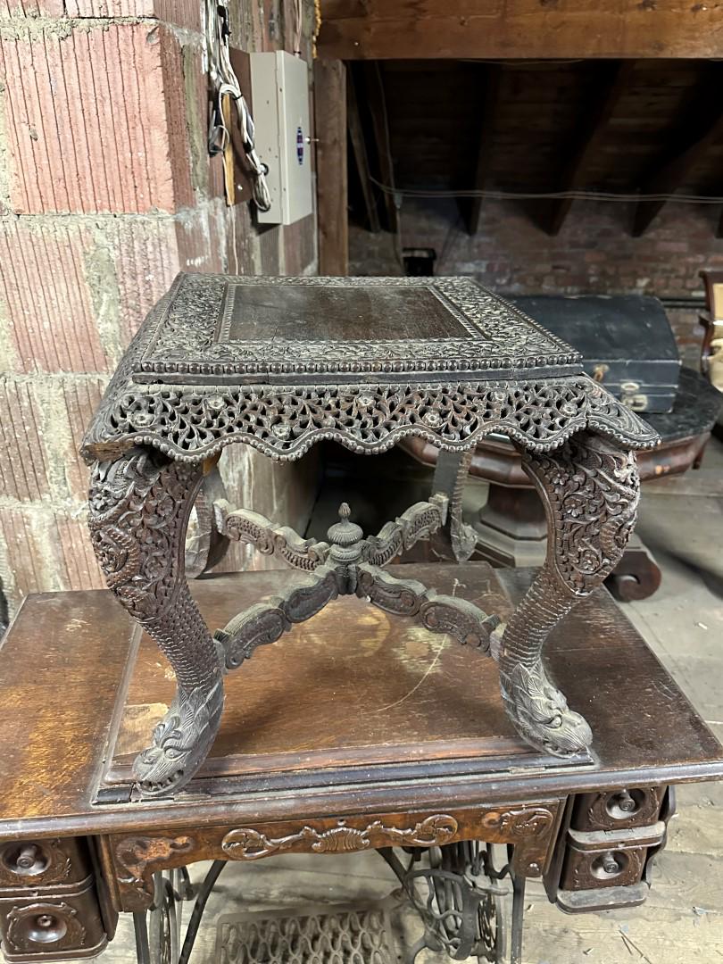 Tibetan Heavily Carved Wood Stand: Intricately carved and pierced wood stand. Animal head feet; 18in.H. x 20in.W. x 20in.D.