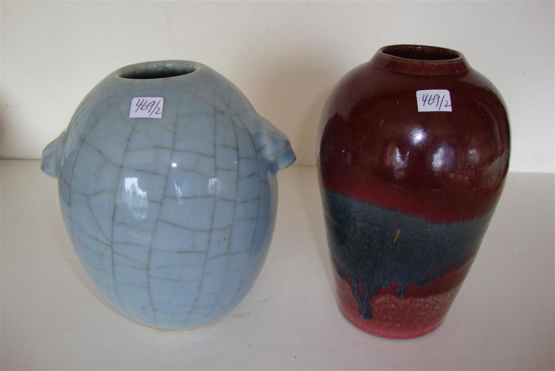 TWO ASIAN POTTERY VASES: One an oxblood and blue drip glaze and one a robins egg blue crackle glaze with molded handles. 7"H
