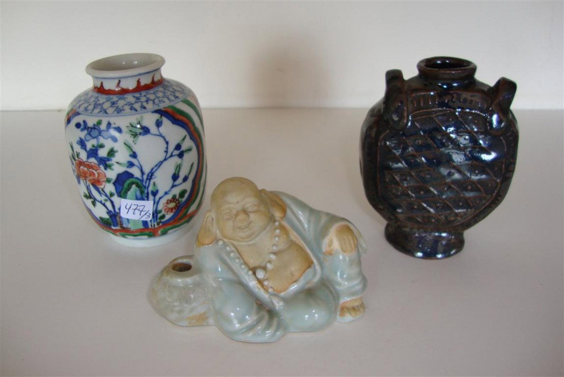 THREE ASIAN ITEMS: A reclining buddha pen holder, a high glaze double handled vase, and a hand painted multi colored vase with garden decorations and a six character signature. All cabinet pieces. 3"H, to 4" H