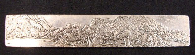SILVER SCROLL WEIGHT: Ornate front and landscape back 8"L
