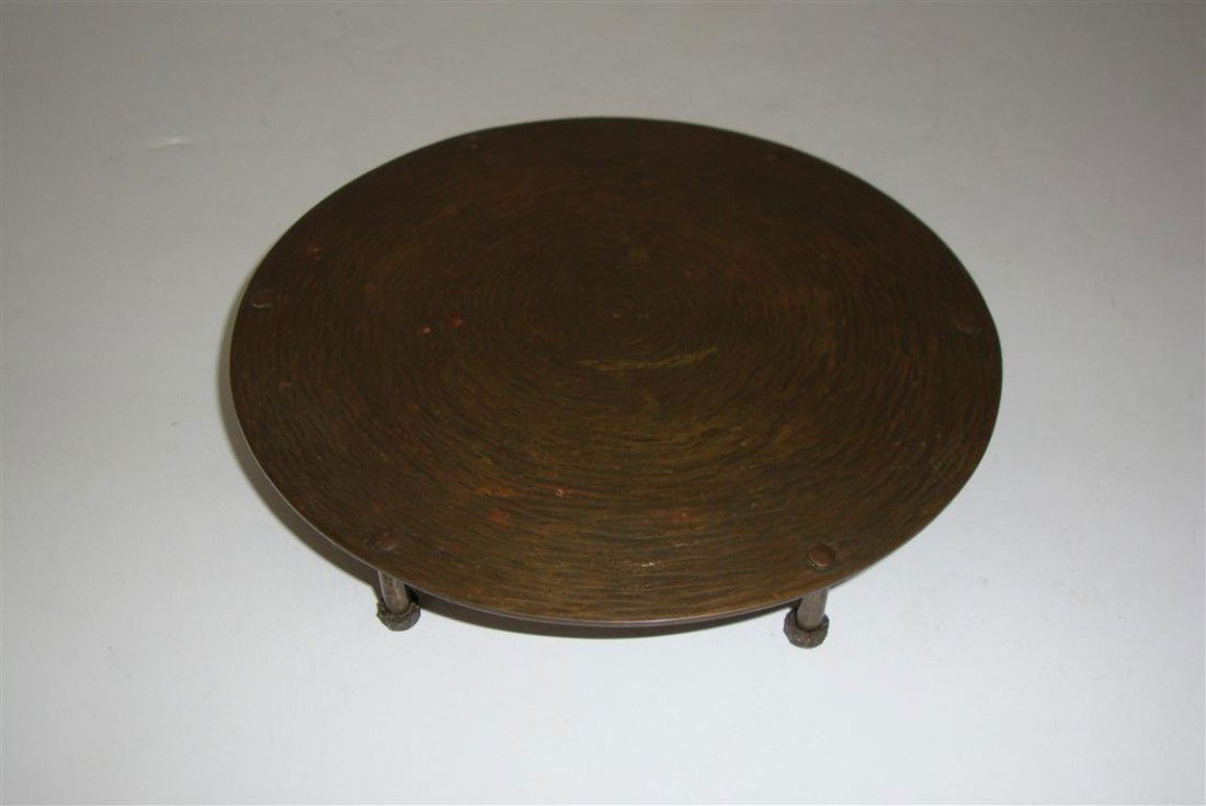 HAND WROUGHT ARTS & CRAFTS TRIVET: Hand wrought footed trivet marked E.T.O Fish Tioga, PA; 6in. D.