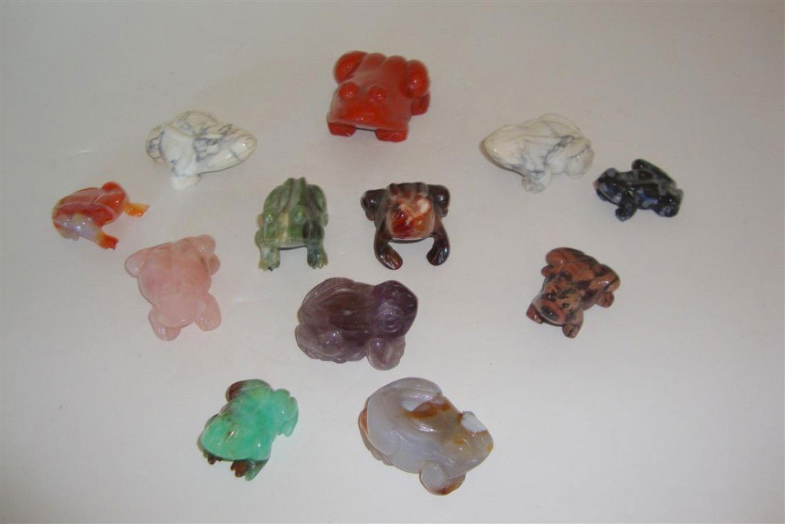 TWELVE HARDSTONE AND SEMI-PRECIOUS STONE FROGS: The lot includes natural amethyst, onyx, marble, alabaster, quartz etc. 1 1/2"L. to 3"L.