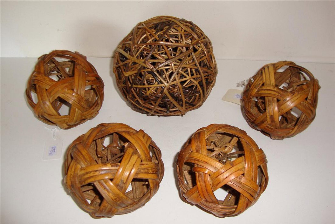 FIVE TURN OF THE CENTURY RATTAN BALLS: C. 1900 rattan balls used in the Philippines for a game called SIPA for which the object was to kick the ball into the air and keep it going. (5) 5" spherical and 6 1/2"