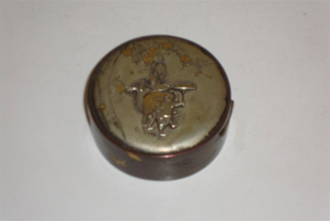 19TH C. JAPANESE BRONZE PILL BOX: 19th C. Japanese bronze covered pill box, raised figural, foliage and butterfly design with mixed metal silver and gold decoration.Meiji period; 1in. H. x 2in. D.