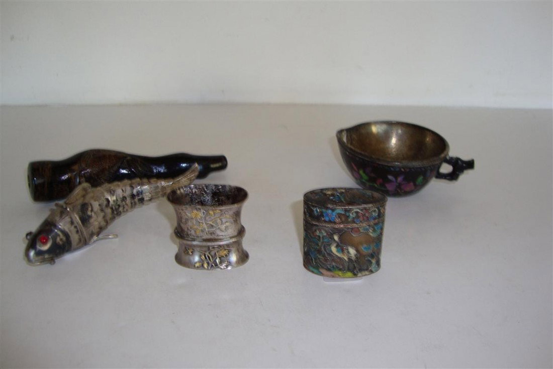LOT OF FIVE(5) 19TH C. JAPANESE ITEMS: Lot to include: a cloisonne enameled pill box with deer design, signed, 1.5in. H.; silver sword mount with gold overlay, 1.5in. H.; a silver snuff box- fish form with articulated tail and jeweled eyes