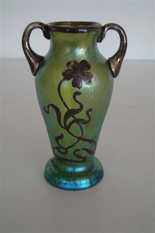 SILVER OVERLAY VASE ATTRIBUTED TO LOETZ: Double handled silver floral overlay vase attributed to Loetz. Unsigned