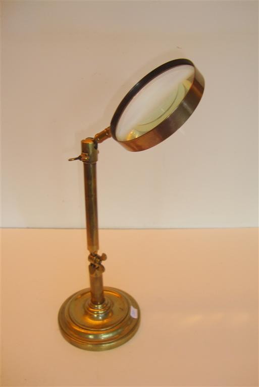 19TH C. BRASS JEWELER'S MAGNIFIER: Adjustable brass jeweler's table top magnifier, weighted base; 16in. H.