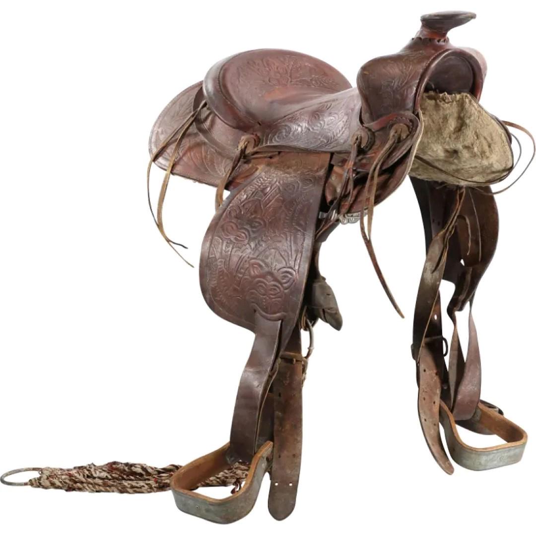 19thC. Hand Tooled Leather Western Saddle: 19thC. Hand tooled embossed leather saddle; Provenance: Guernsey's, NY - The Harrisburg Auction - Day 6 Auction: 7/20/13