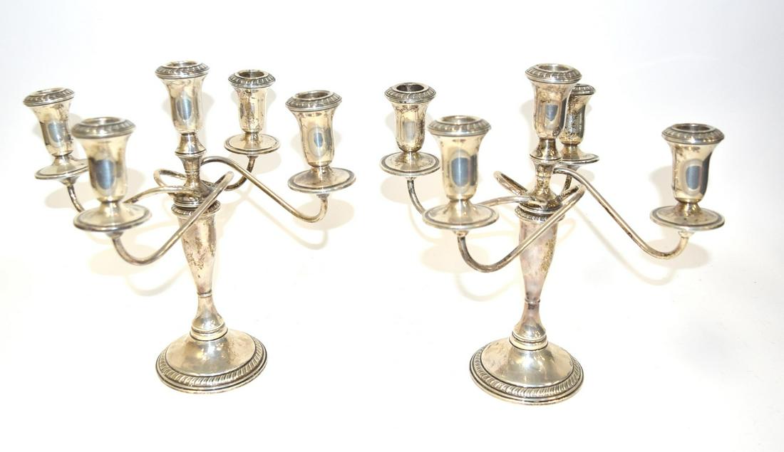 Pair of Sterling Silver Candelabra: Pair of sterling silver five-arm candelaba; Marked Sterling at the underside. Weighted; 11in.H. x 11in.W.