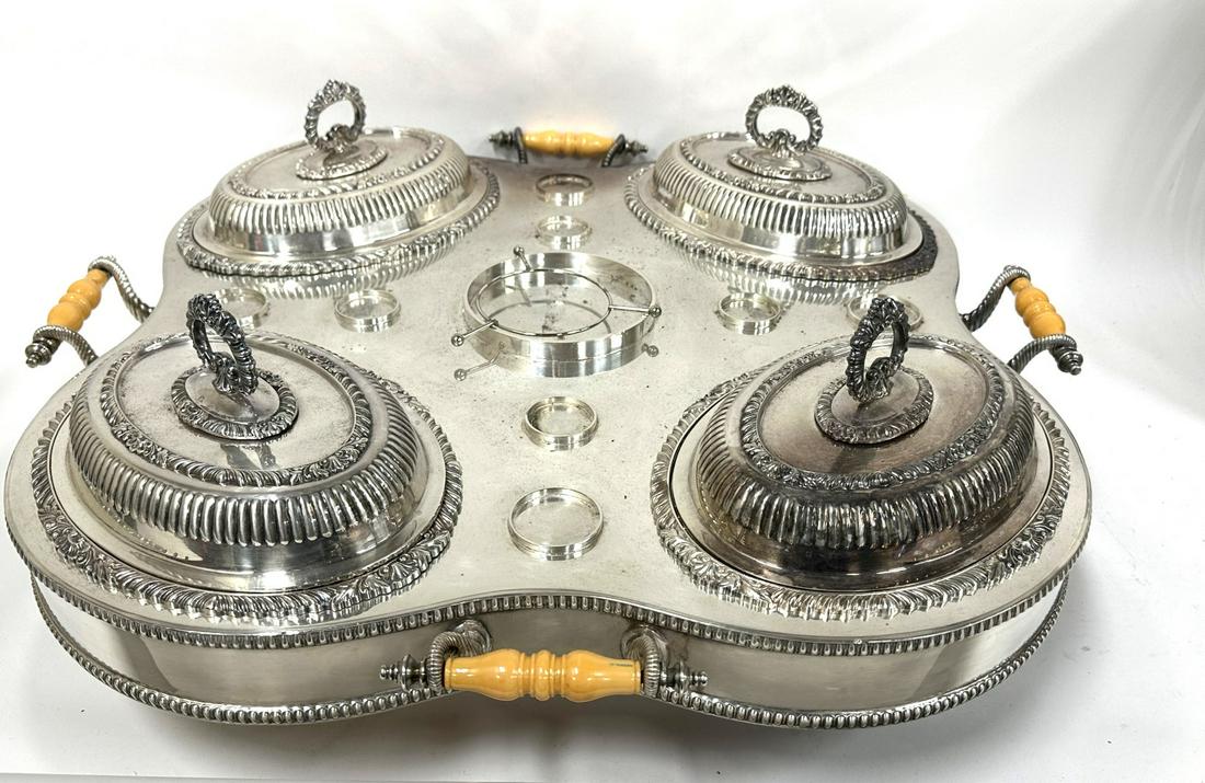Sheffield Silver Plate Lazy Susan Chaffing Dish: Four(4) compartment silver plate revolving Lazy Susan serving piece. Bakelite handles; 10in.H. x 26in.W.