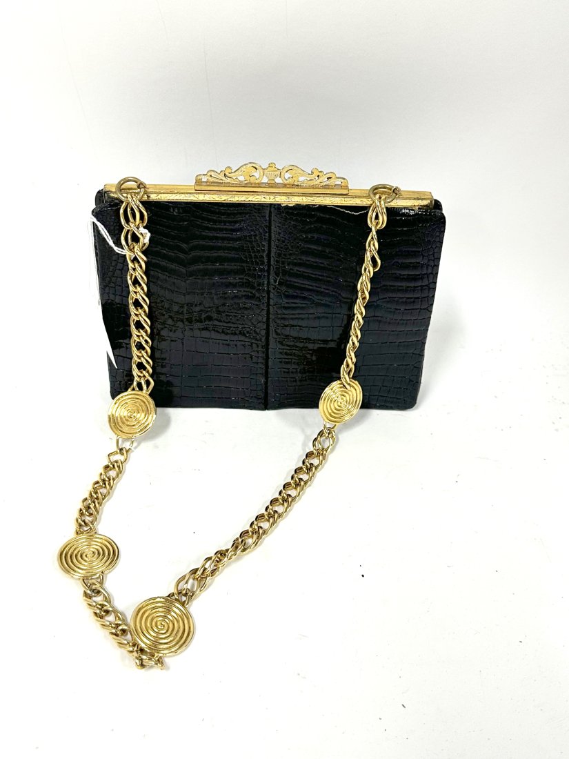 Henri Bendel Fine Alligator Purse: Ornate gold frame at top, chain link shoulder strap. Henri Bendel label at the inside. Diminuitive size