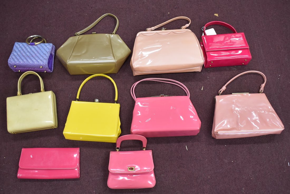 Dealer's Lot of Purses. Patent Leather & Wicker (10): Ten in the lot. Mostly patent leather. Various colors inc. hot pink, pink, brown, yellow, sharp yellow and tan. Also included in the lot is a purple wicker handbag.